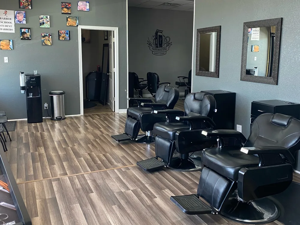 The academy floor: black chairs, mirrors and stations under the FadeMasterz mark