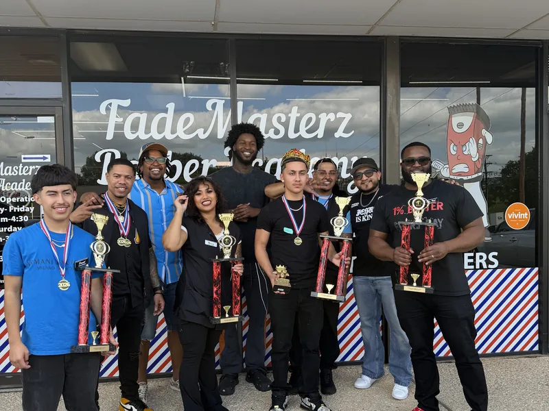 Students and instructors outside the academy with trophies