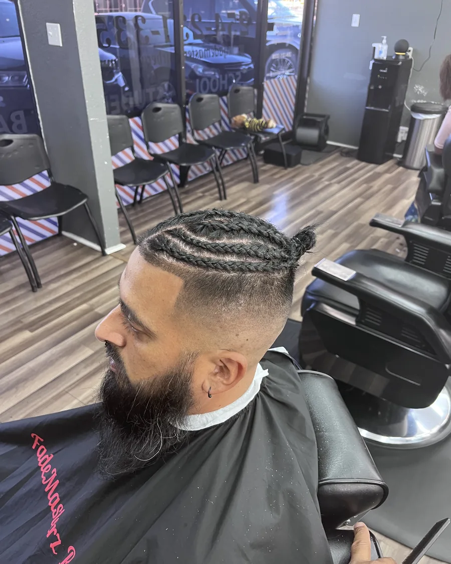 A client with braids after a beard and edge clean-up at an academy station