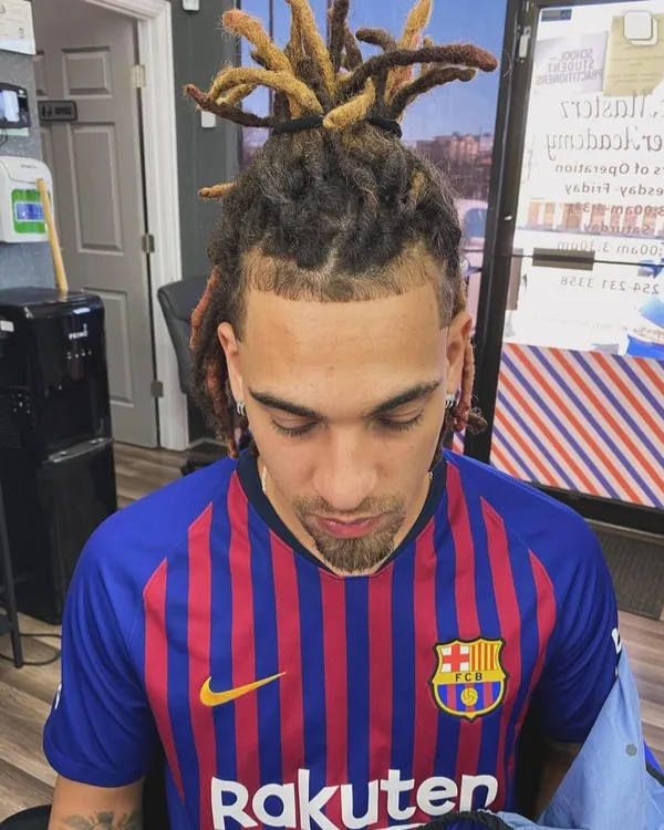 A client with locs pulled up after a lineup